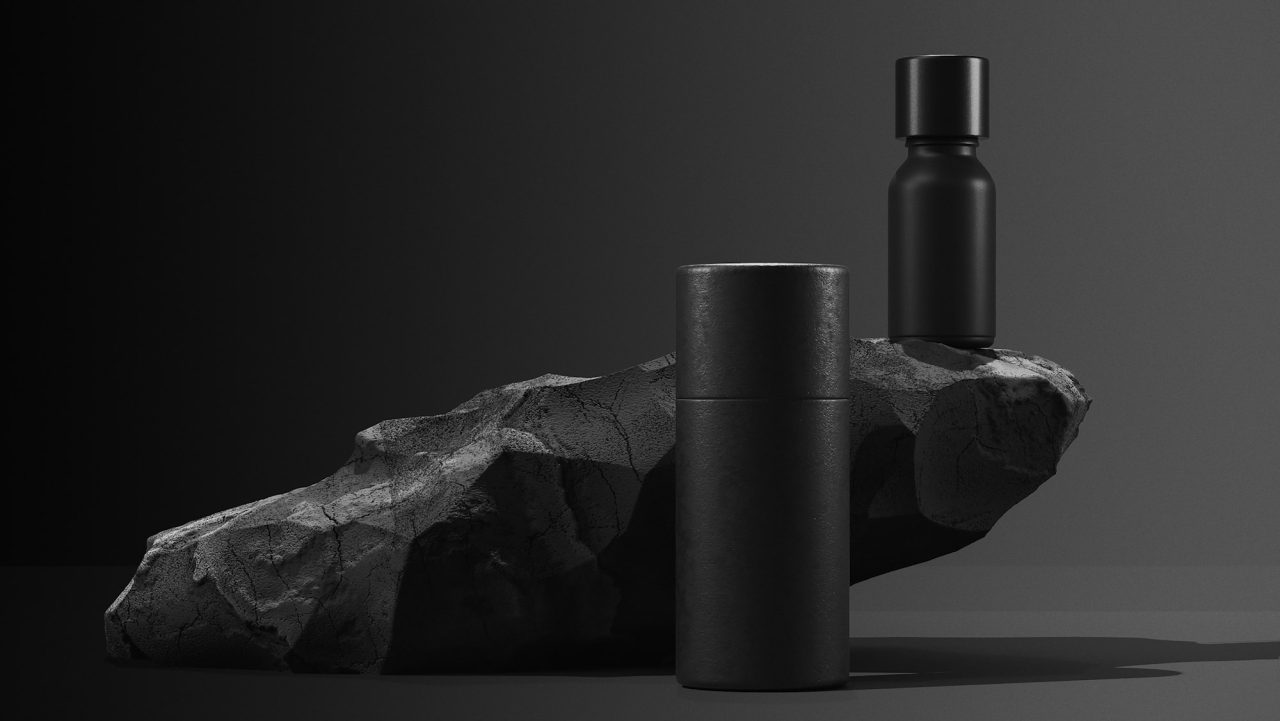 bottle of essential massage oil on stone beauty treatment minimal black design packaging mock up.jpg